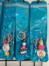 Load image into Gallery viewer, Mystery Barefoot Corner Pens and Keychains
